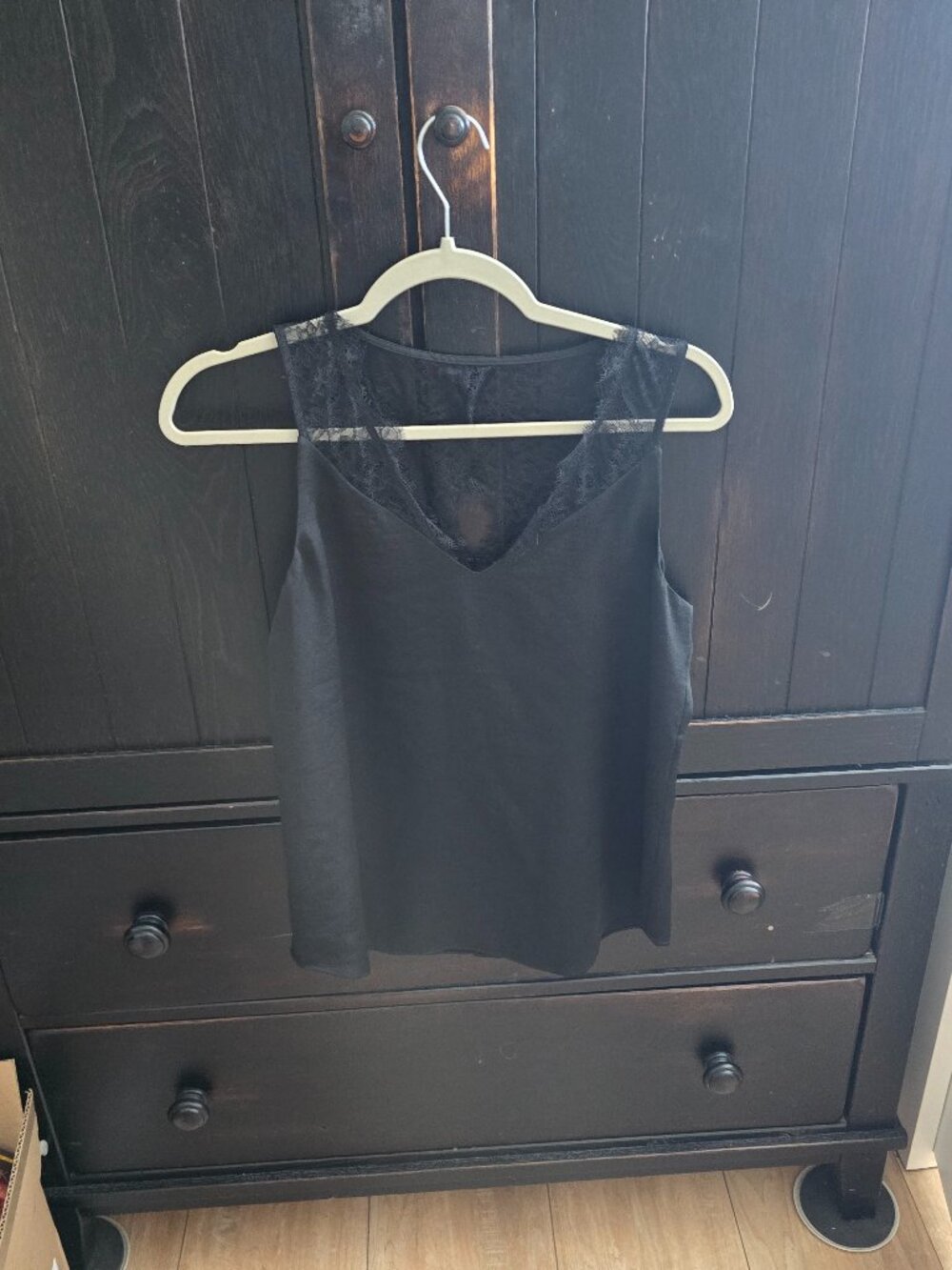 Express black top with an elegant V-neckline with delicate sheer lace panel S